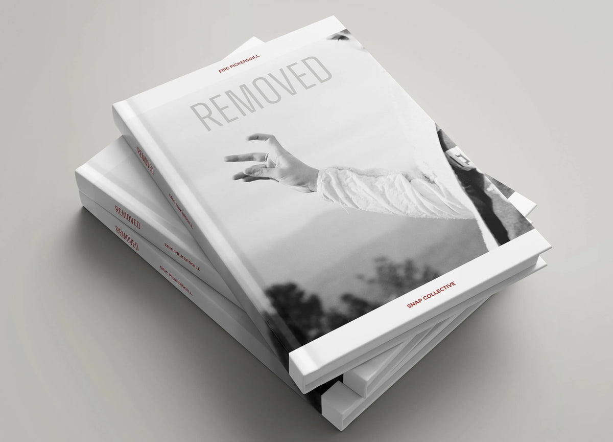 Removed, the book — signed page