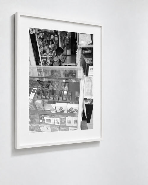 Cell Shop Boy, Shillong, India, 2017 — framed on wall