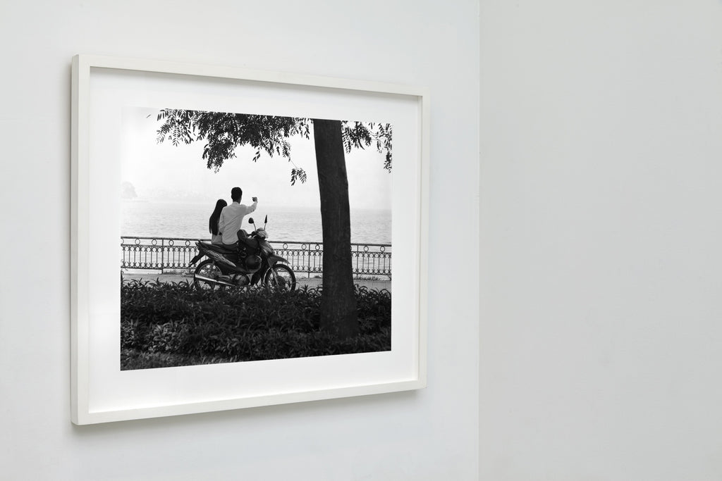 Lake McCain Couple, Hanoi, Vietnam, 2018, a framed black and white fine art print by Eric Pickersgill