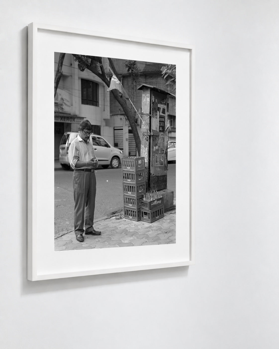 Man Beneath a Flag, Kolkata, India, 2017 — framed on wall