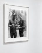 Marcio and Marcos, Rocinha, Brazil, 2025 — framed on wall