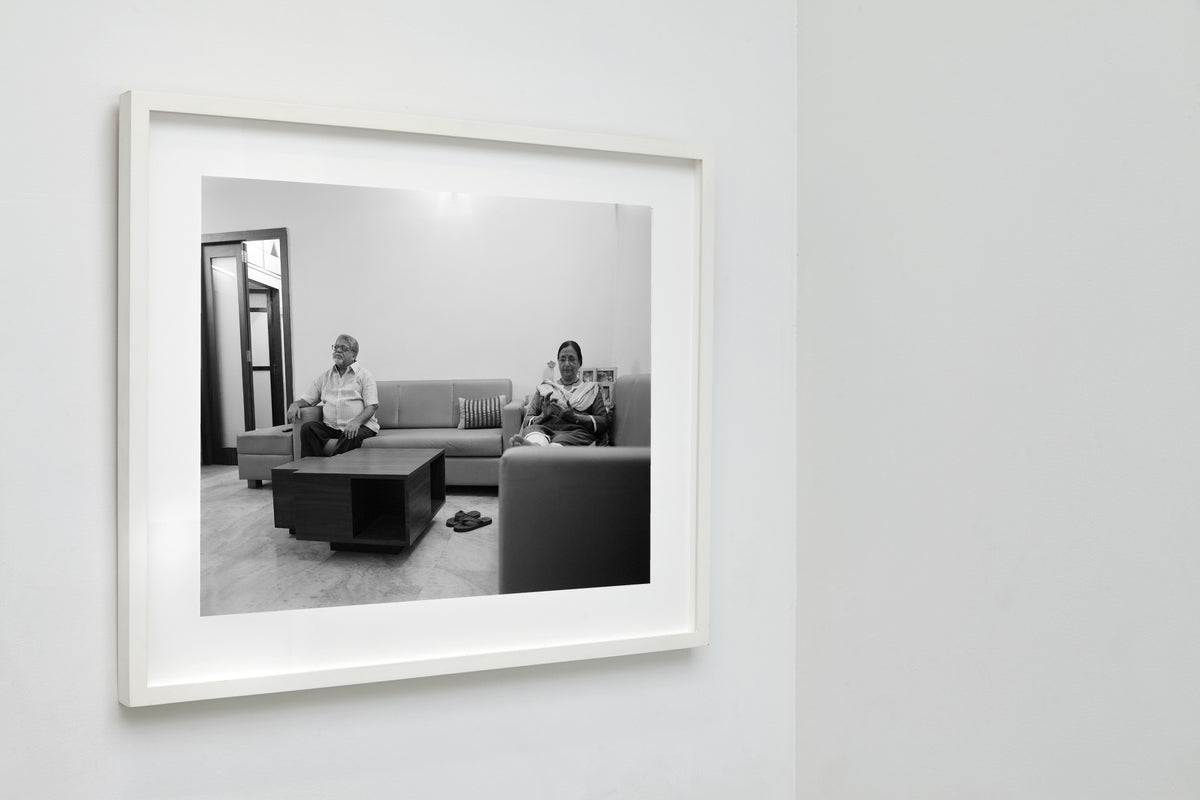Parents' Evening Routine, Mumbai, India, 2017, a framed black and white fine art print by Eric Pickersgill